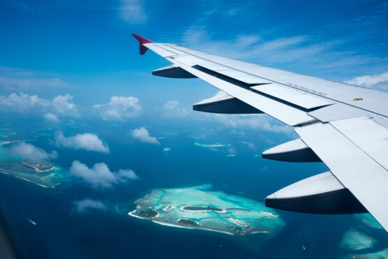 Maldivesarrival. Plane flying over maldives.